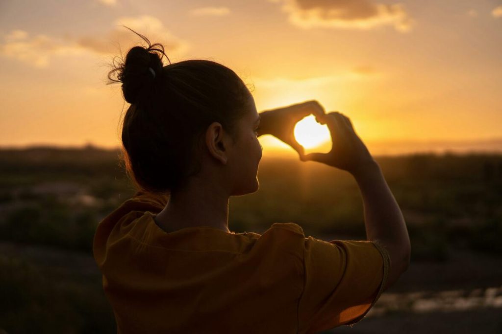 woman-doing-hand-heart-sign